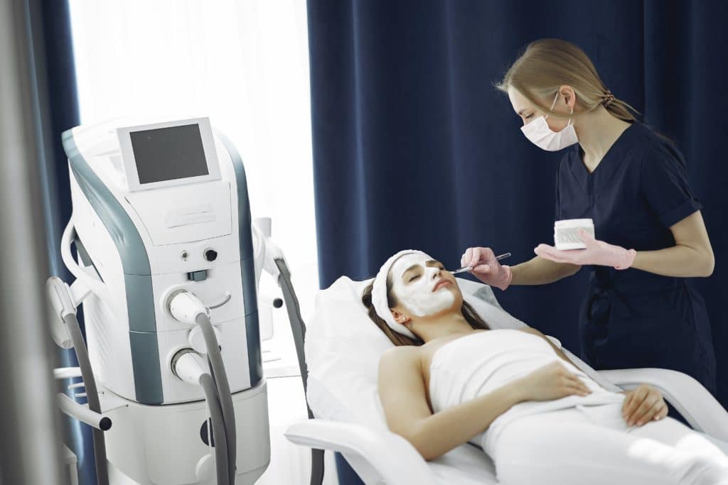 woman receiving facial treatment