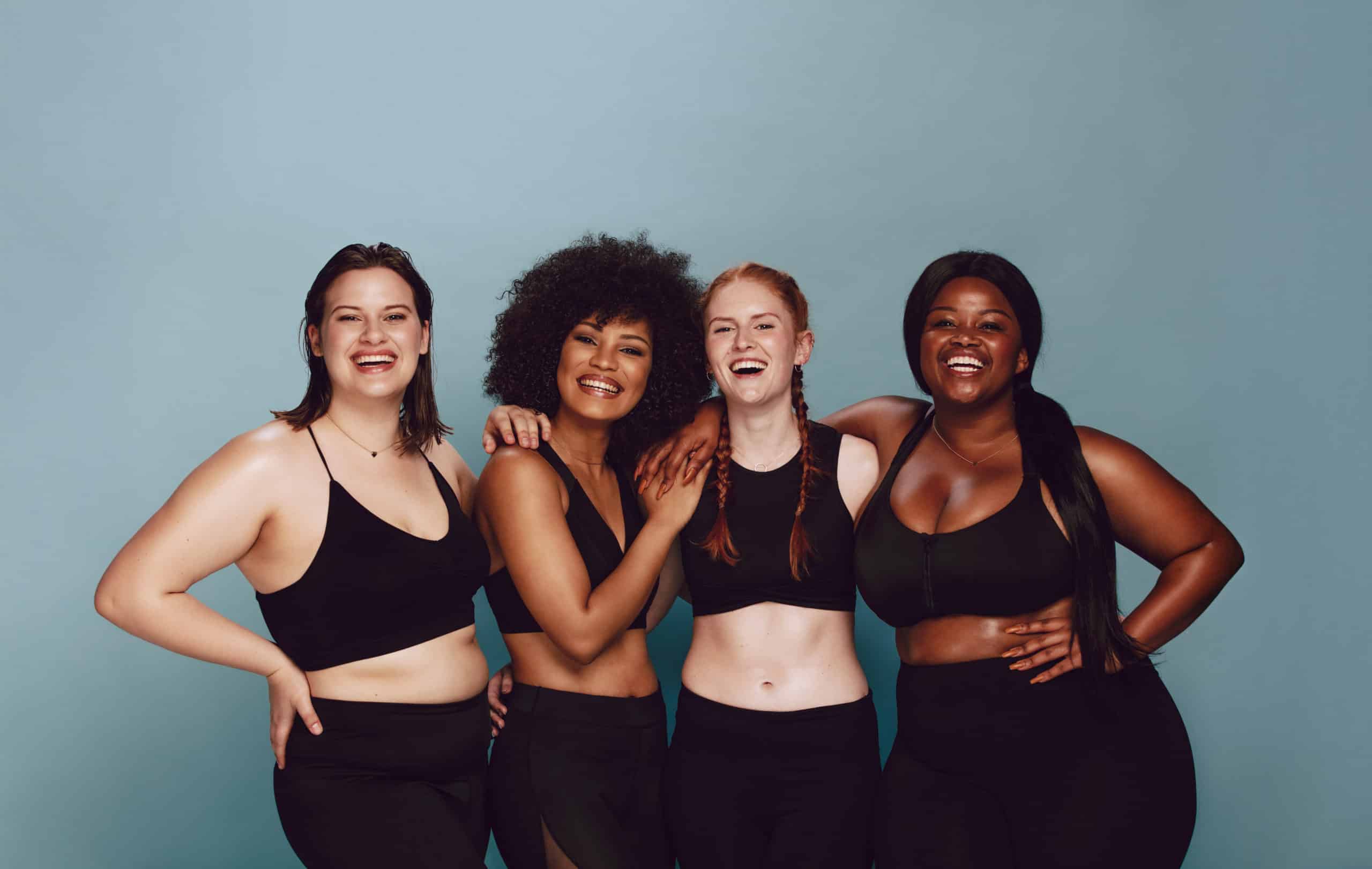 Portrait Of Group Of Women Posing Together In Sportswear